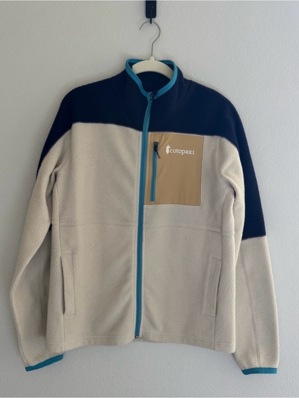 Cotopaxi Cream and Black Lightweight Fleece Jacket with Tan Chest Pocket